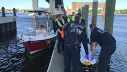 Three boaters were rescued from cold water Wednesday by Tiverton, MA, firefighters after choppy waves capsized their powerboat.