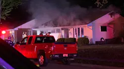 A Vandalia, OH, firefighter suffered smoke inhalation battling a house fire early Wednesday.