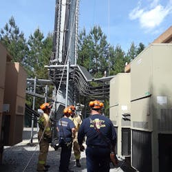 Gwinnett County, GA, firefighters rescued an injured worker who was dangling 100 feet above the ground on a cell tower. Gwinnett County, GA, firefighters rescued an injured worker who was dangling 100 feet above the ground on a cell tower.