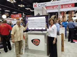 Dawn Dalldorf-Jackson, Streamlight director of sales, Industrial/Fire Divisions presents Streamlight’s donation check to NFFF Chief Ronald Siarnicki. Dawn Dalldorf-Jackson, Streamlight director of sales, Industrial/Fire Divisions presents Streamlight’s donation check to NFFF Chief Ronald Siarnicki.