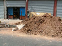 2. The spoil pile here is too close to the trench. Note the slab of roadway in the picture as well; if this fell into the trench, it could seriously injure a worker. 2. The spoil pile here is too close to the trench. Note the slab of roadway in the picture as well; if this fell into the trench, it could seriously injure a worker.
