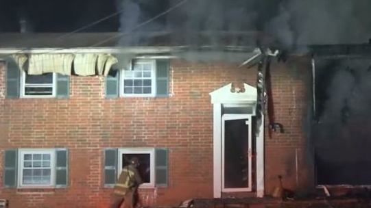An East Point, GA, firefighter suffered from heat exhaustion and was hospitalized following a house fire early Saturday that also sent a resident to the hospital and left two dogs dead.