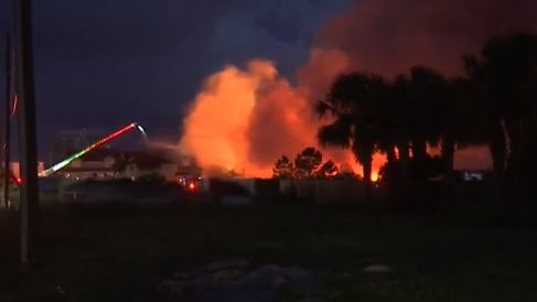 The 'massive' condo fire in Perdido Key, FL, destroyed 14 of 20 units and injured a firefighter and a resident early Wednesday.