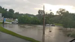 Storms caused Gravois Creek in Crestwood, MO, to overflow its banks Wednesday, creating a flash flood that stranded 40 visitors to Whitecliff Park.