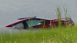 Palm Beach, FL, rescue divers pulled a man from a canal in Jupiter after his car became submerged in the water Sunday.