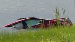 Palm Beach, FL, rescue divers pulled a man from a canal in Jupiter after his car became submerged in the water Sunday. Palm Beach, FL, rescue divers pulled a man from a canal in Jupiter after his car became submerged in the water Sunday.