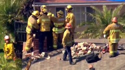 Los Angeles County firefighters rescued a teenager who was trapped in a two-story apartment complex's chimney Wednesday in Inglewood. Los Angeles County firefighters rescued a teenager who was trapped in a two-story apartment complex's chimney Wednesday in Inglewood.