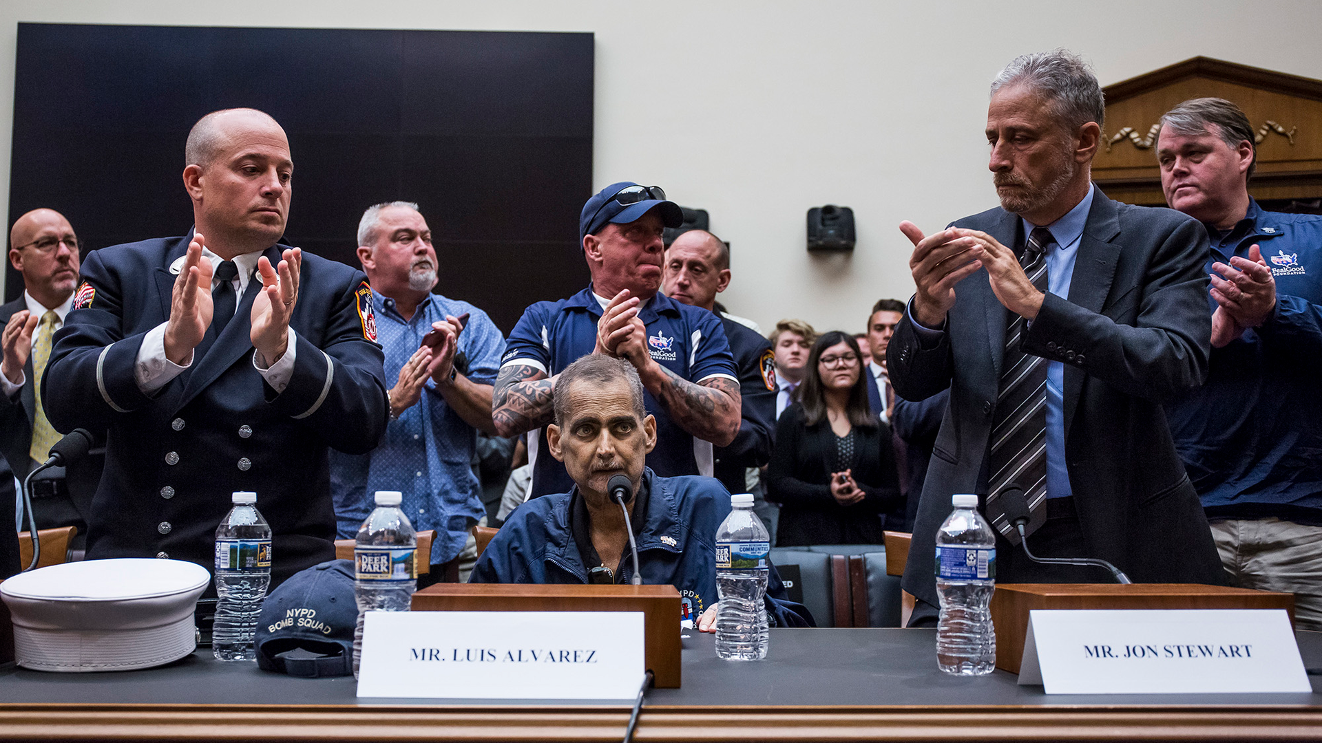 Attendees applaud after testimony from Luis Alvarez, a retired New York Police Department detective and 9/11 first responder, during a House Judiciary Committee hearing on reauthorization of the Sept. 11 Victim Compensation Fund on Capitol Hill on June 11 in Washington, D.C.