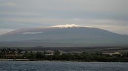 Hawaii County firefighters rescued a man who broke his leg while trying to take photos atop Mauna Kea on Monday night.