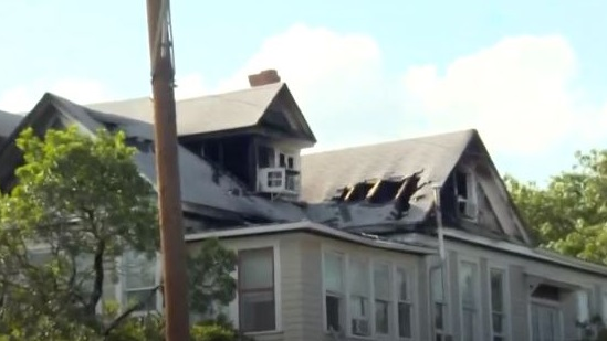 About 100 San Antonio firefighters battled a blaze Sunday at a three-story apartment building in the Monte Vista neighborhood.