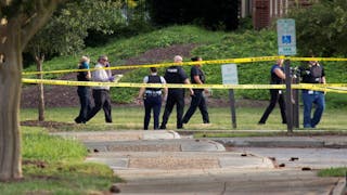 Police work the scene where 12 people were killed during a mass shooting at the Virginia Beach city public works building on Friday, May 31, 2019.