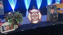 Remembrances line a table during a memorial service on Saturday, June 1, 2019, for Boise firefighter Charlie Ruffing, who took his own life at his station.
