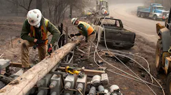 PG&E workers dissemble broken power lines after the Camp fire ripped through Paradise, CA, in November 2018.