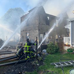 Seven Boston firefighters were hurt battling a nine-alarm blaze that spread to eight homes in the Mattapan neighborhood Saturday.