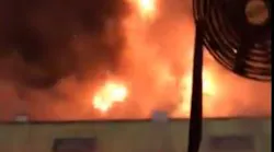 Dozens of Orange County, FL, firefighters battled a two-alarm fire at a Pine Hills auto shop early Thursday.