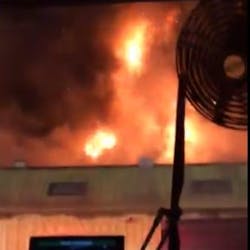 Dozens of Orange County, FL, firefighters battled a two-alarm fire at a Pine Hills auto shop early Thursday.
