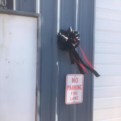 A donated black ribbon hangs at the Mathiston, MS, Volunteer Fire Department following the death of acting Fire Capt. Todd Lathrip on Thursday.