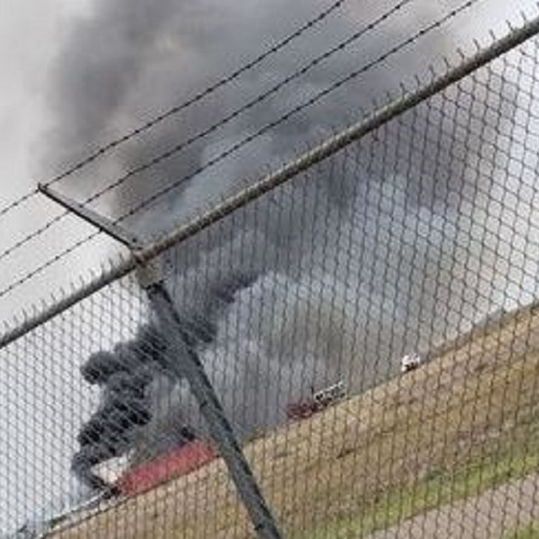 Smoke pours from a building where fireworks were being stored after an explosion that injured 12 firefighters at an air strip in Roswell, NM, on Wednesday, June 5, 2019.