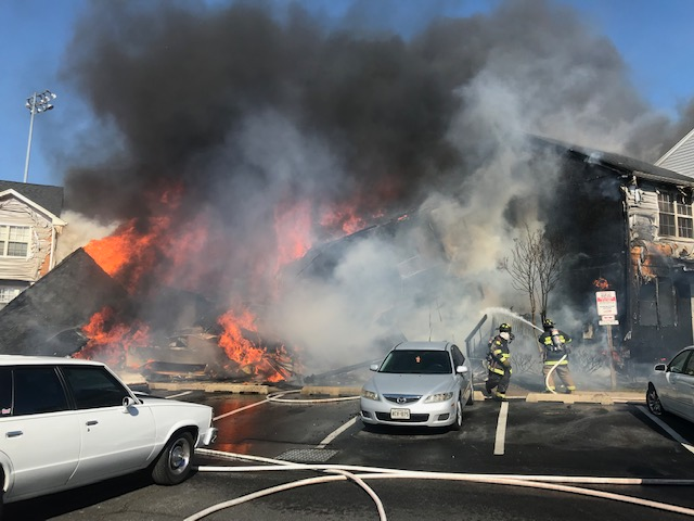 Two residents died and several firefighters were injured when the end unit collapsed.