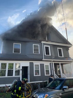 Seven Boston firefighters were hurt battling a nine-alarm blaze that spread to eight homes in the Mattapan neighborhood Saturday.