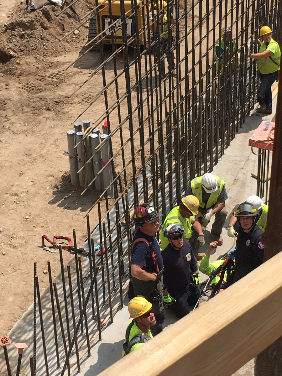 Minneapolis firefighters used an aerial device and stretcher to rescue a worker from below ground level at a downtown Minneapolis construction site Monday.