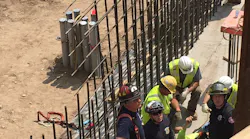 Minneapolis firefighters used an aerial device and stretcher to rescue a worker from below ground level at a downtown Minneapolis construction site Monday.