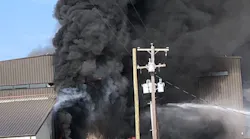 Smoke rises from a burning hangar after a small plane crashed at an airport in Addison, TX, killing all 10 people aboard on Sunday, June 30, 2019.