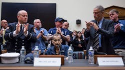 Attendees applaud following testimony from Retired New York Police Department detective and 9/11 responder Luis Alvarez (center) during a House Judiciary Committee hearing on reauthorization of the September 11th Victim Compensation Fund.