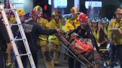 Anaheim, CA, and Orange County crews rescued a worker who was knocked into a 20-foot deep hole by a car that crashed into a construction site Monday night.