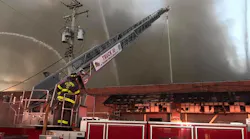 More than 60 Baltimore City firefighters battled a four-alarm warehouse fire Monday.