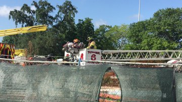 Houston firefighters rescued as many as nine construction workers after the top floor of a hotel under construction collapsed as they poured concrete Monday.
