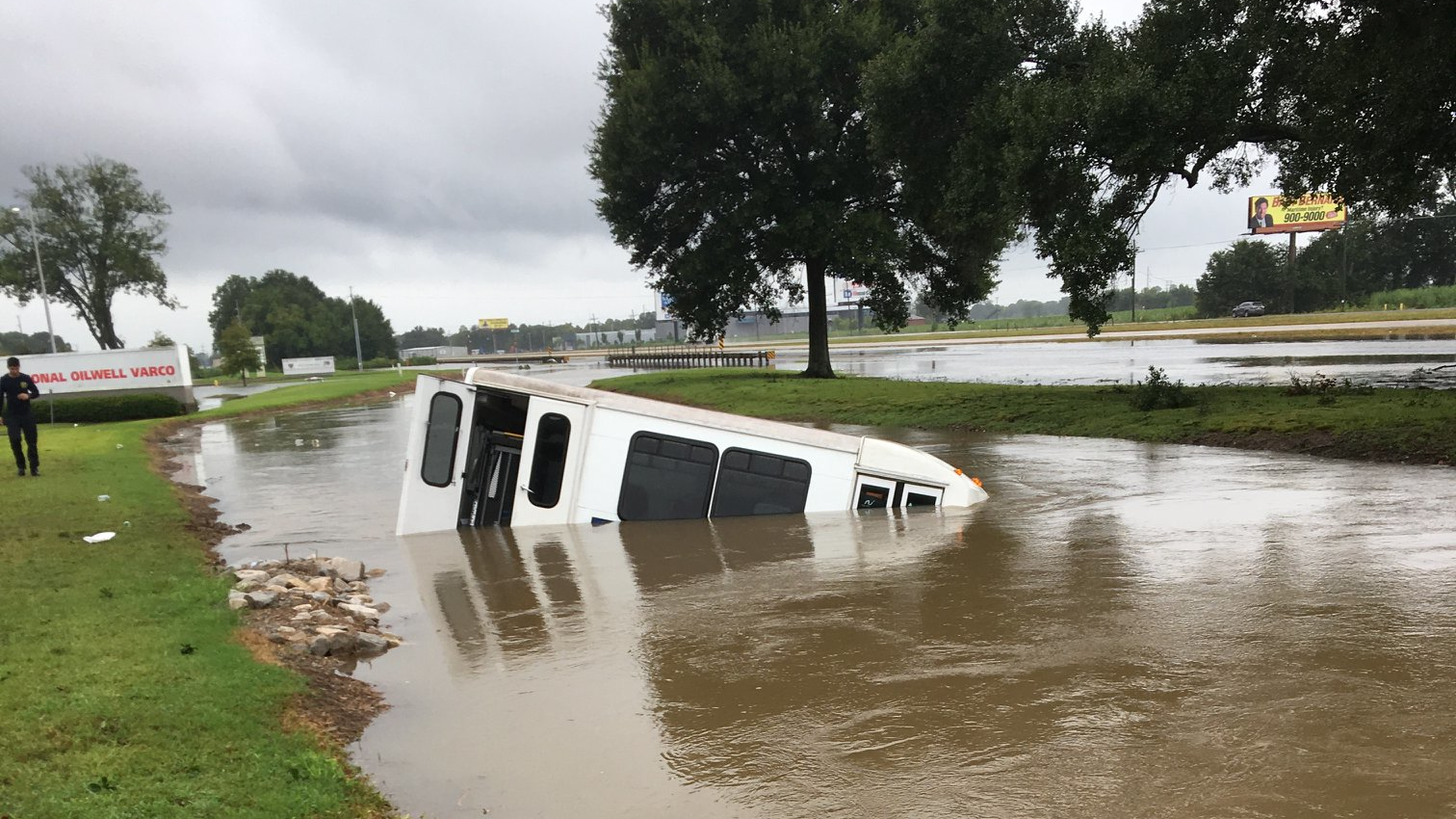 Firefighters rescued eight disabled occupants from a submerged bus Sunday following Hurricane Barry.