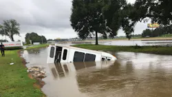 Firefighters rescued eight disabled occupants from a submerged bus Sunday following Hurricane Barry.