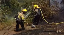 Firefighters from four departments battled a one-acre brush fire Tuesday in San Diego&apos;s Sabre Springs community.