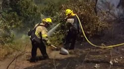 Firefighters from four departments battled a one-acre brush fire Tuesday in San Diego's Sabre Springs community. Firefighters from four departments battled a one-acre brush fire Tuesday in San Diego's Sabre Springs community.
