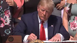 President Donald Trump signs the “Never Forget the Heroes: James Zadroga, Ray Pfeifer and Luis Alvarez Permanent Authorization of the September 11th Victim Compensation Fund Act' into law Monday in the White House Rose Garden.