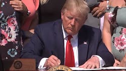 President Donald Trump signs the &ldquo;Never Forget the Heroes: James Zadroga, Ray Pfeifer and Luis Alvarez Permanent Authorization of the September 11th Victim Compensation Fund Act&apos; into law Monday in the White House Rose Garden.