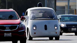 A Google self-driving car travels eastbound on San Antonio Road in Mountain View, CA.