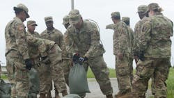 Army National Guard soldiers fill sandbags as they prepare for Tropical Storm Barry to make landfall in New Orleans on July 12, 2019.