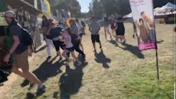 People flee after shots were fired Sunday at the Gilroy Garlic Festival in northern California.