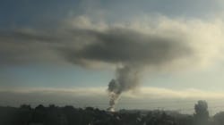 A plume of smoke can be seen from miles away after a fire broke out at a maintenance facility at San Francisco International Airport on Wednesday, July 31, 2019.