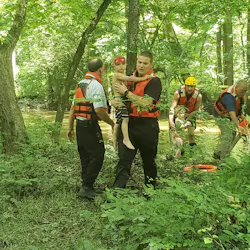 Greenville, PA, firefighters rescued four people— two adults and two young children— after their raft became entangled on a downed tree in the Shenango River on Tuesday.