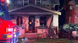 Two Kansas City, MO, firefighters suffered burns while battling a blaze authorities believe was ignited by fireworks.