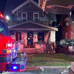 Two Kansas City, MO, firefighters suffered burns while battling a blaze authorities believe was ignited by fireworks. Two Kansas City, MO, firefighters suffered burns while battling a blaze authorities believe was ignited by fireworks.