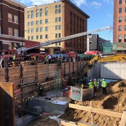 Minneapolis and St. Paul firefighters rescued a worker who became trapped in a collapsing trench Monday.