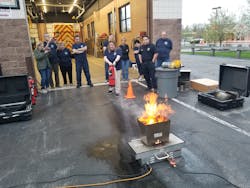 Citizens Fire Academy (CFA) learning why and how firefighters use extinguishers.