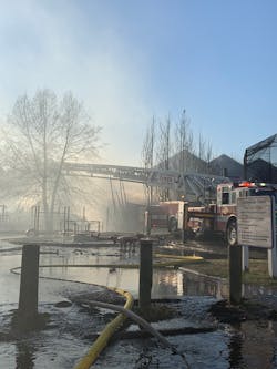 Deputy Chief Tim Clark, Huntingtown VFD, recalls that when he first arrived, the scene from the rear was hard to assess due to the smoke and burning trees. Deputy Chief Tim Clark, Huntingtown VFD, recalls that when he first arrived, the scene from the rear was hard to assess due to the smoke and burning trees.