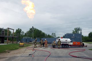 Vapor flaring to reduce pressure within the leaking tank during water injection.