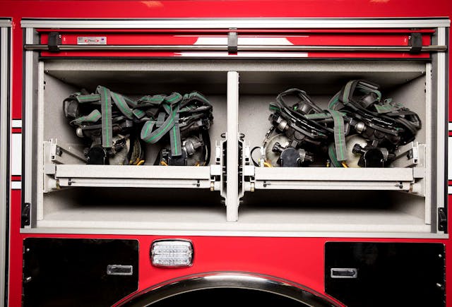 Roll-out shelves for gear and SCBAs makes it convenient for firefighters to leave contaminated items out of cabs