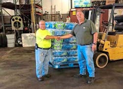 Greensburg Knights of Columbus Grand Knight Jefferey Peterinelli, left, presents a pallet of water bottles to Greensburg Fire Chief Thomas Bell. Greensburg Knights of Columbus Grand Knight Jefferey Peterinelli, left, presents a pallet of water bottles to Greensburg Fire Chief Thomas Bell.